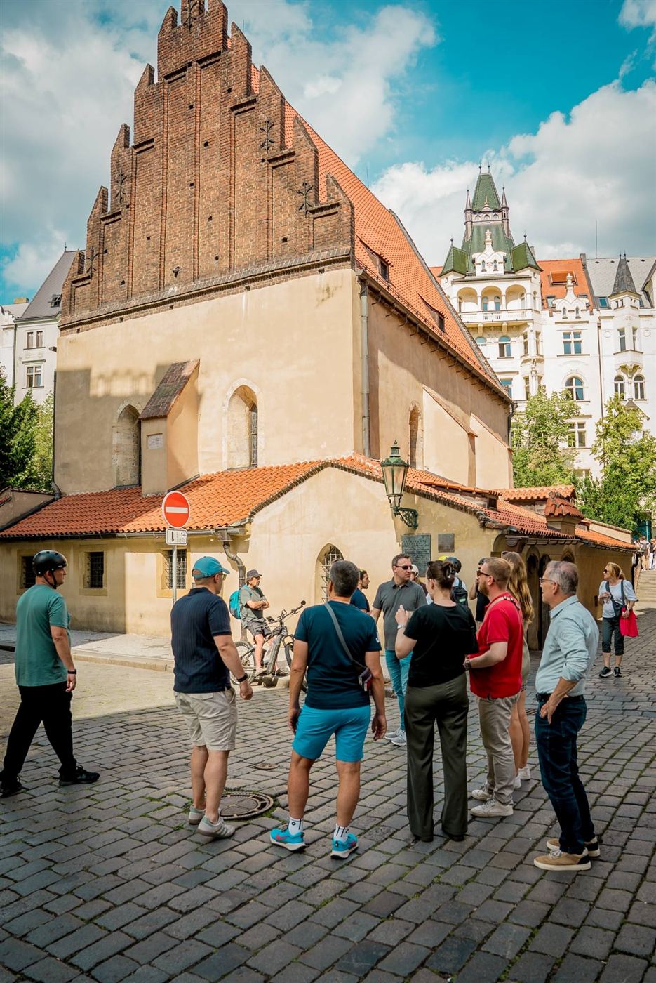 A team in front of the Old-New Synagogue