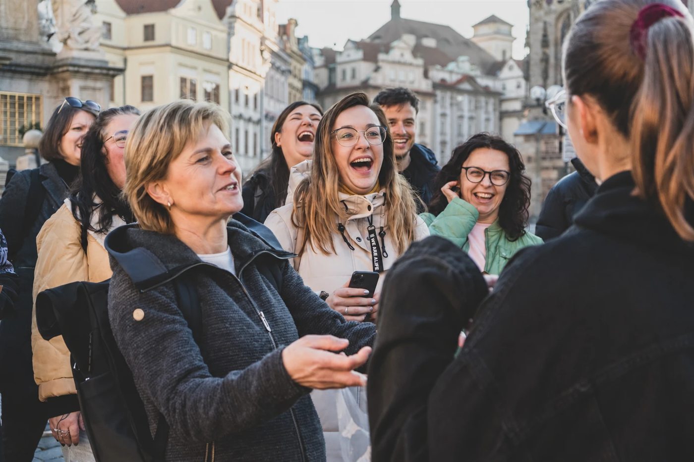 Players laughing out loud on Old Town Square