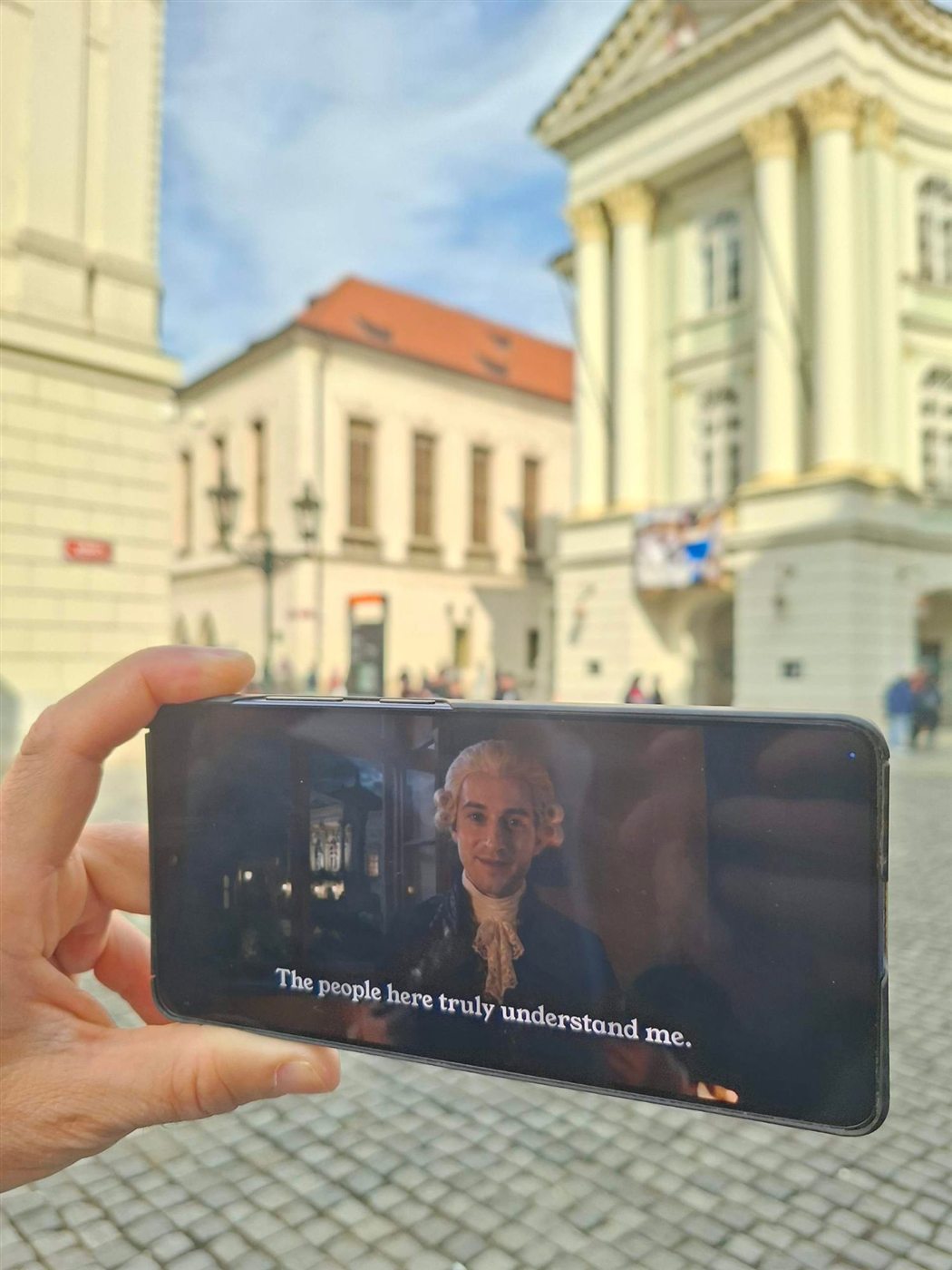 Mozart on a phone in front of the Estates Theatre: “The people here truly understand me.”