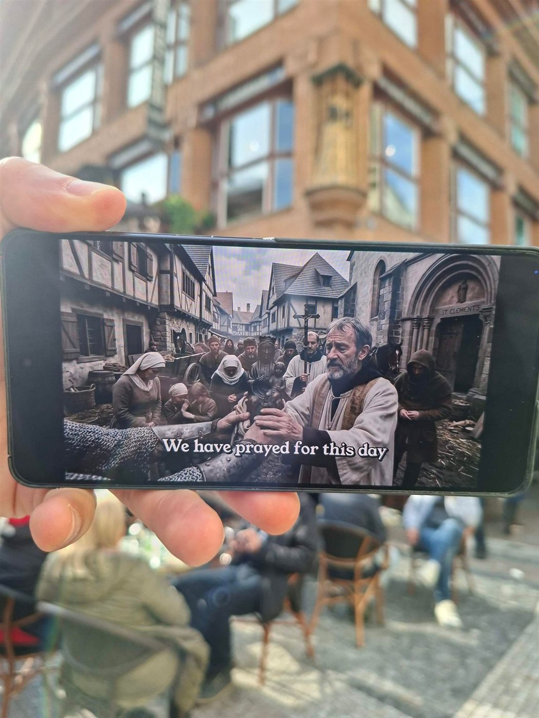 A monk scene on a phone in Celetná Street: “We have prayed for this day”