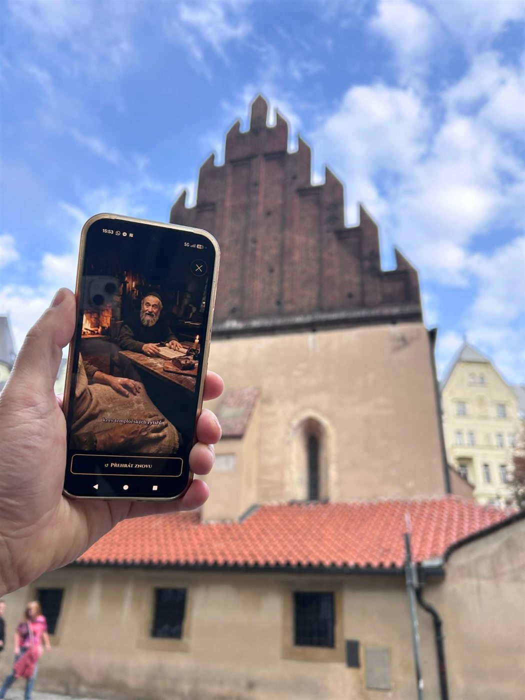 Rabbi Loew on a phone in front of the Old-New Synagogue